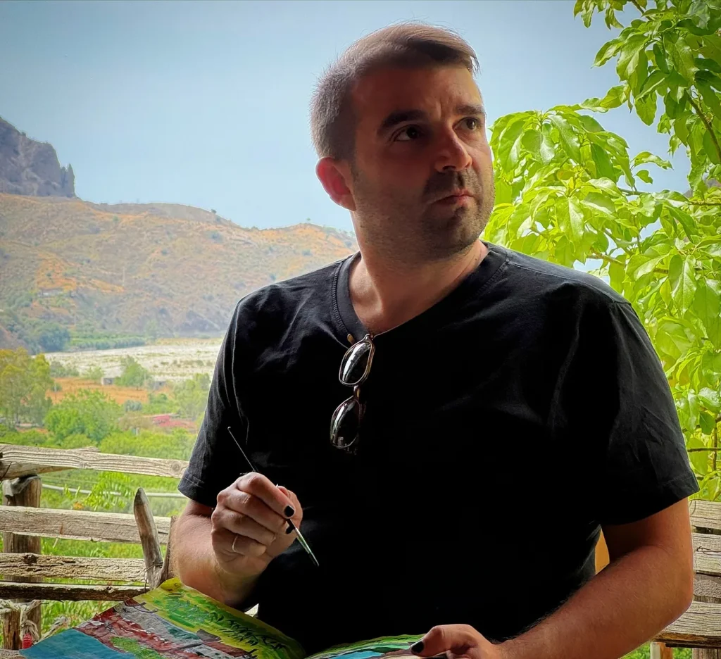 Fabio Meazza drawing and painting during a creative activity